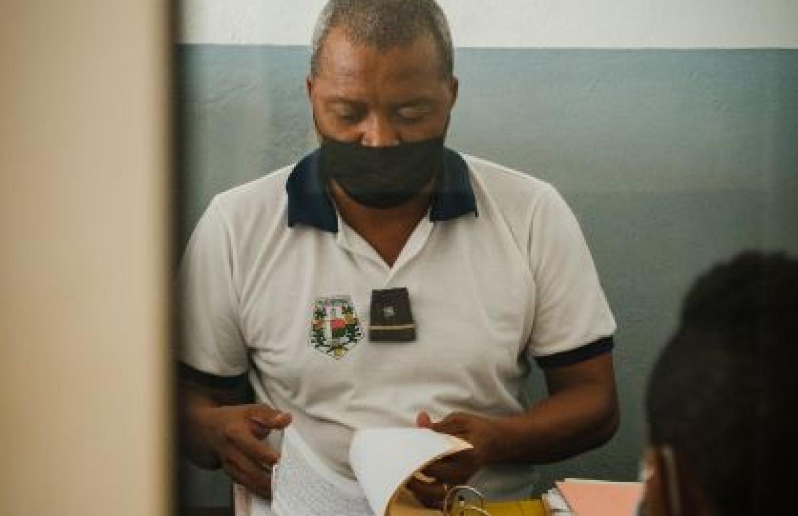 Male officer going through records