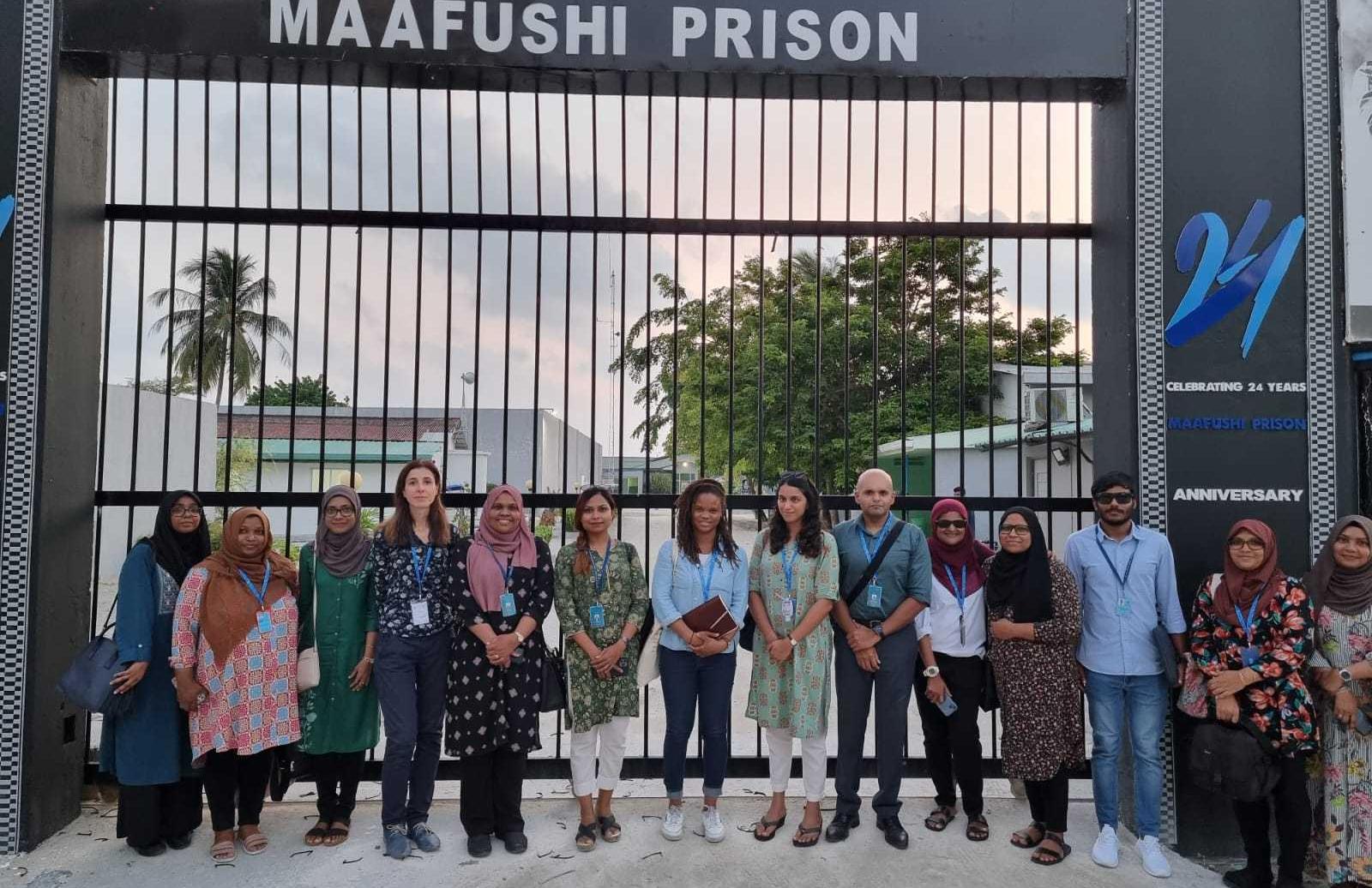 APT and Human Rights Commission team pose in front of prison gate
